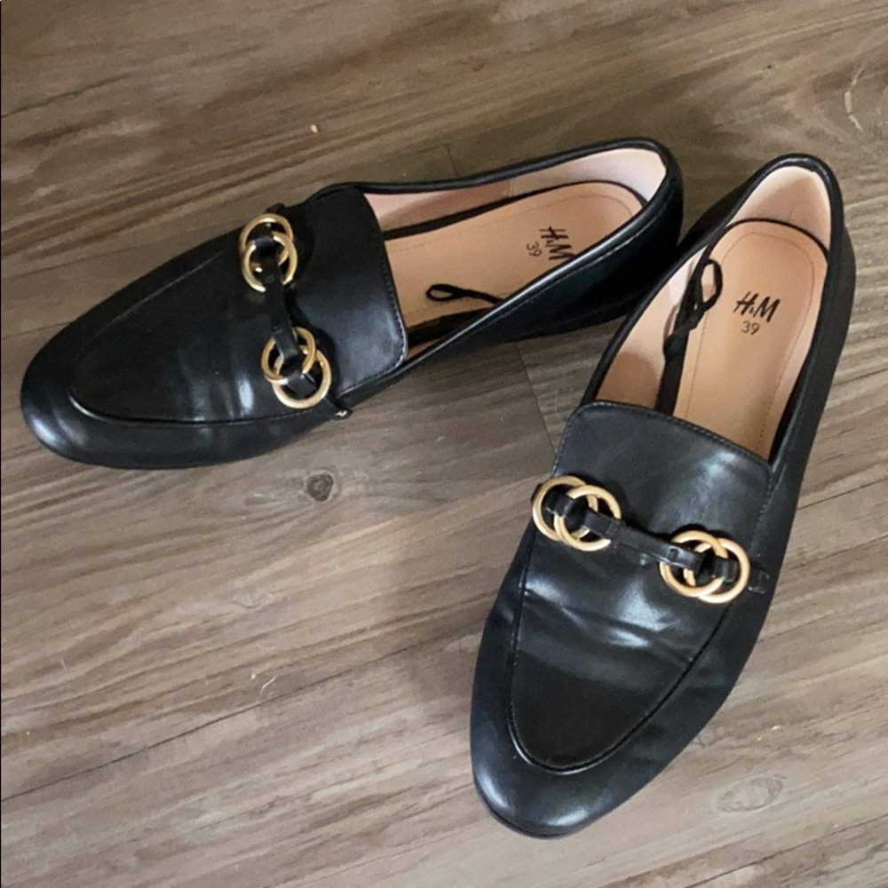 Black and gold loafers